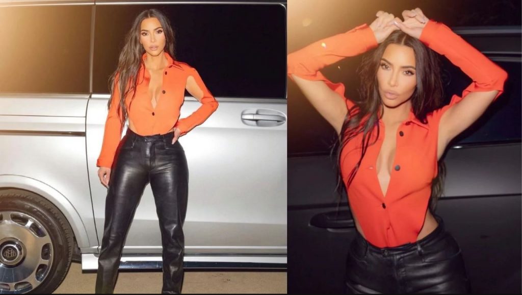 Kim Kardashian pozon joshëse pranë makinës luksoze me bluzën e zbërthyer